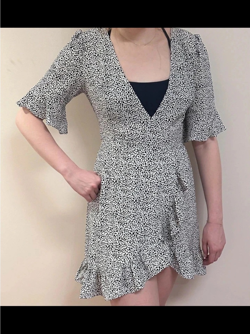 Black and white wrap dress with ruffle trim